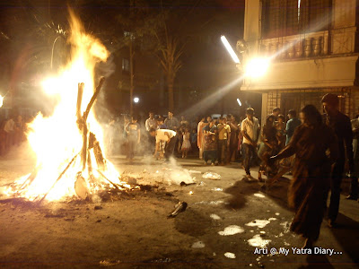 Offering water to the to the Holika Dahan bonfire on Choti Holi