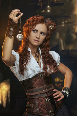 An example of underbust corsets being used in women's steampunk fashion. This girl is wearing her underbust corset with a blouse and gloves.