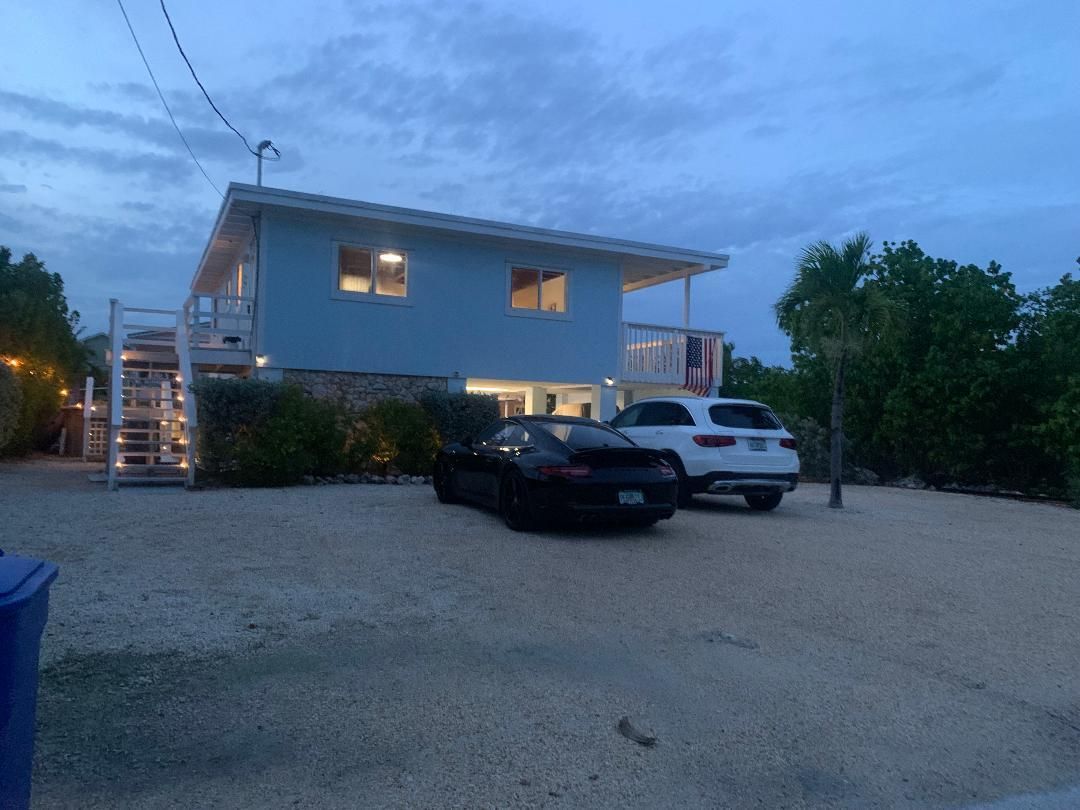 Real Estate in the Florida Keys Concrete Pilings, frame canal front house in Key Largo 850K