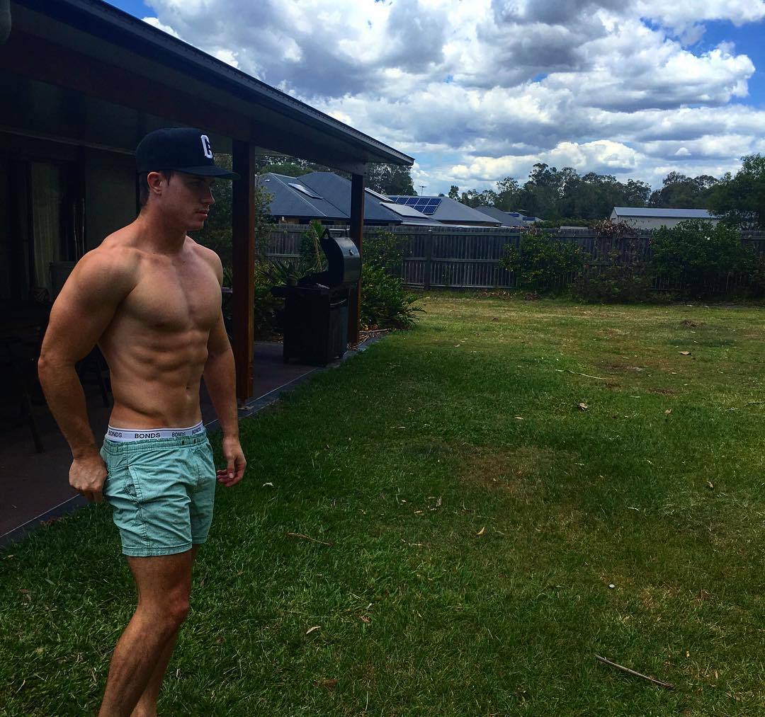 young-teen-jock-strong-shirtless-sexy-body-green-grass-lawn