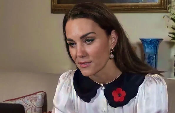 Ghost London Boo blouse. Kate Middleton wore a new satin ivory Peter Pan–style collar blouse from Ghost London. Kate is wearing pearl earrings
