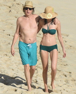  In an aqua trunks, Paul McCartney, 73, accompanied his beautiful 5 years lover, Nancy Shevell, 56, for walking in a green bikini as The couple seemed very enjoy the St Barts situation of beach on Sunday afternoon, December 27, 2015.