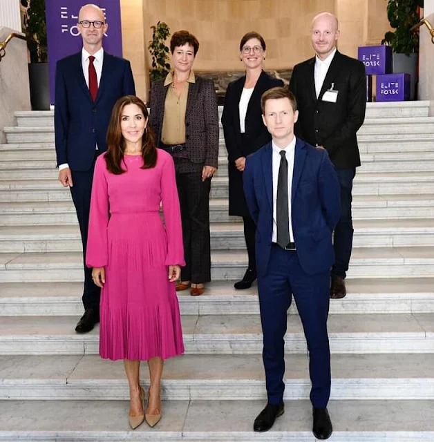 Crown Princess Mary wore a pink long sleeve pleated midi dress from No 21. Prada pumps