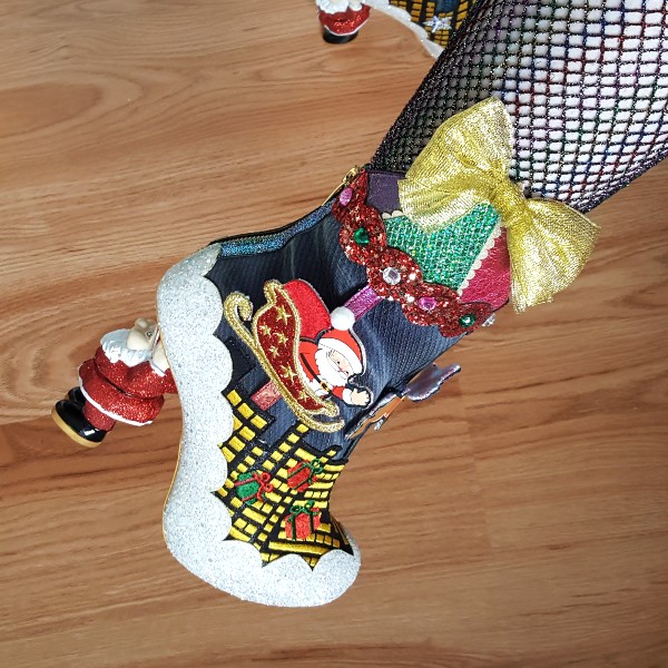 close up of Santa sleigh movable character on ankle boots