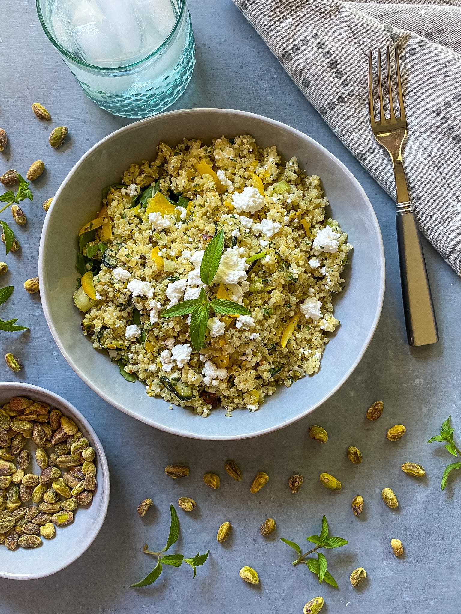 quinoa salad with zucchini, pistachios, mint and feta