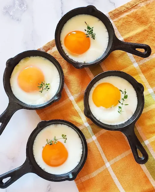fried eggs in mini cast iron skillets