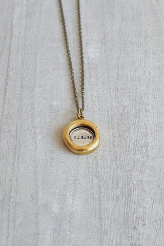 http://www.whitetrufflestudio.com/collections/mother-s-day-collection/products/custom-date-rustic-seal-necklace