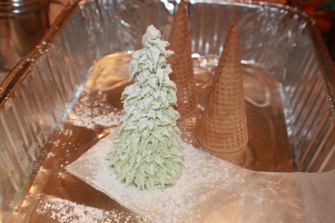 this is a big turkey tin with Christmas trees made out of sugar cones and frosting