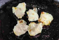 Roasting and cooking chicken malai tikka on a tawa or pan