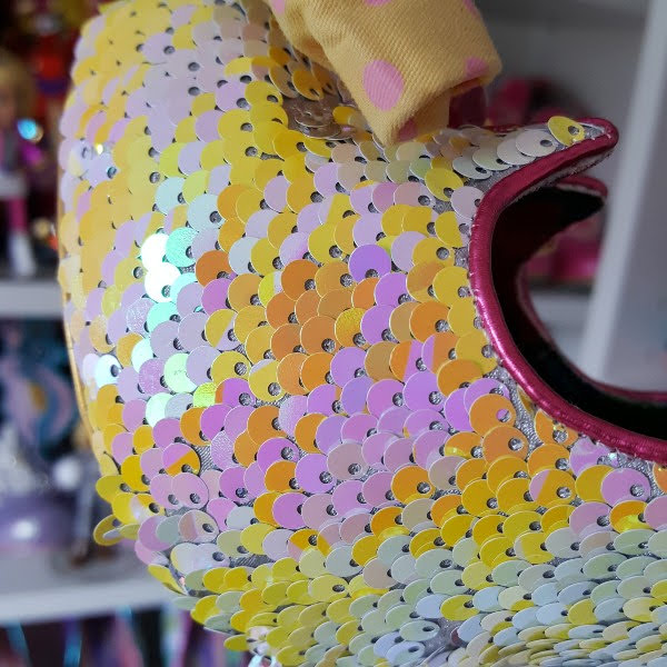 close up of yellow and violet sequins uppers on shoes