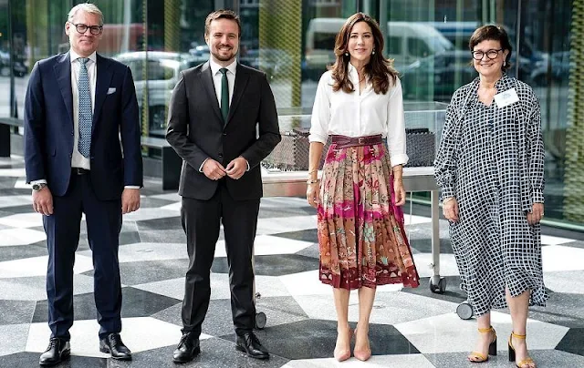 Crown Princess Mary wore a pleated printed silk crepe-de-chine midi skirt and white silk shirt from Valentino