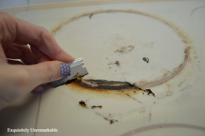 Using A Razor Blade To Clean A Glass Cooktop