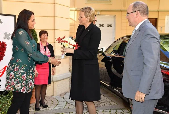 Prince Albert and Princess Charlene distributed gifts to beneficiaries of the Monaco Red Cross on the occasion of the national holiday