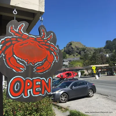colorful crab "open" sign at Cafe Aquatica in Jenner, California