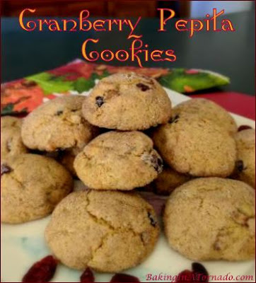 Cranberry Pepita Cookies are Fall in cookie form. Pumpkin flavored cookies are studded with cranraisins and pepitas. | Recipe developed by www.BakingInATornado.com | #recipe #cookies