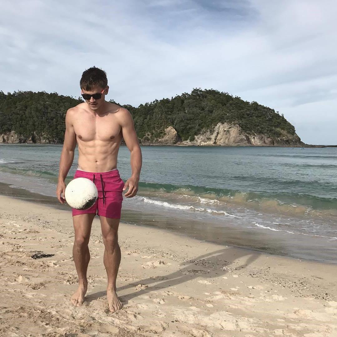 cute-fit-shirtless-beach-dudes-sunglasses-playing-ball