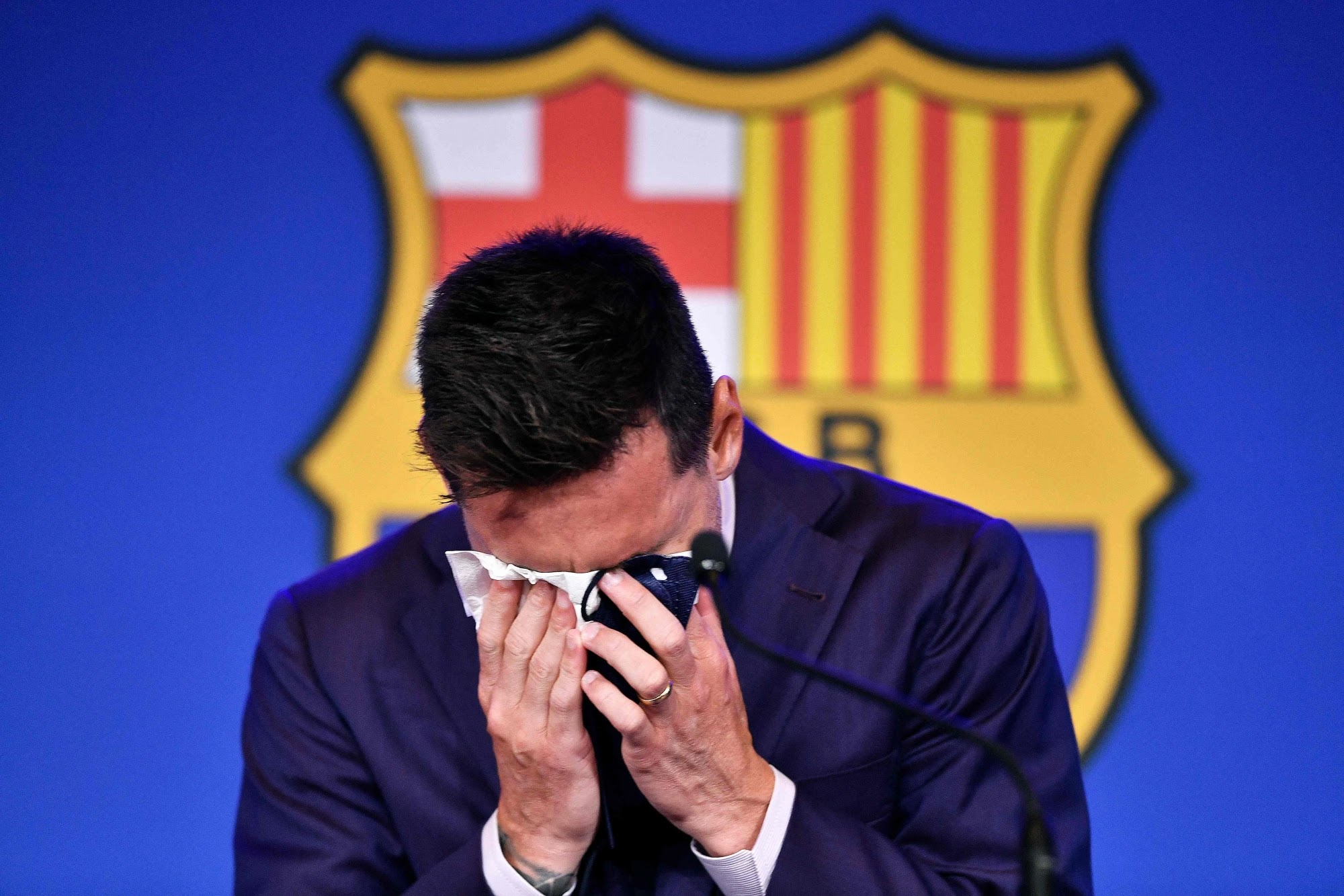 Argentinian forward Lionel Messi cries during a press conference in Barcelona. Argentinian forward Lionel Messi cries during a press conference in Barcelona.