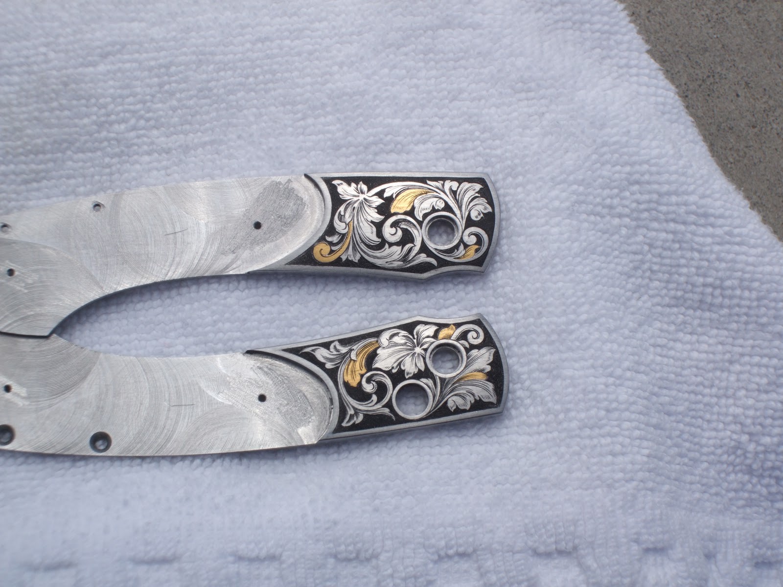 Gary Griffiths Gun Engraving knife bolsters engraved for William Henry