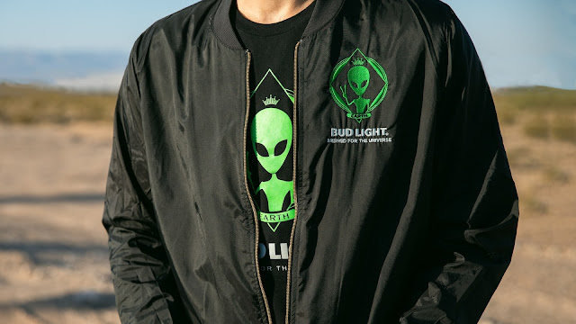 To bring the raid to fans everywhere, Bud Light is also producing a line of limited-edition merch to match the alien-themed Bud Light Cans. Starting today, legal drinking aged fans can purchase items online from the abgiftshop.com. Merch includes koozies, shirts, hat and bomber jackets and prices range from $100 or less.