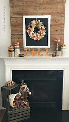Vintage, Paint and more... fall mantel with farmhouse chalkboard, vintage paper leaf wreath and book page columns, fabric pumpkins, and wood crates