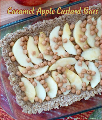 Caramel Apple Custard Bars feature and oat crust and a custard center with apples and caramel. The flavors of Fall in a dessert bar. | Recipe developed by www.BakingInATornado.com | #recipe #bake