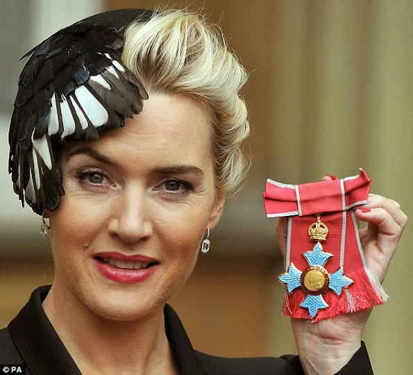 Kate Winslet awarded CBE by The Queen at Buckingham Palace. Kate Winslet in Alexander McQueen at Investiture Ceremony