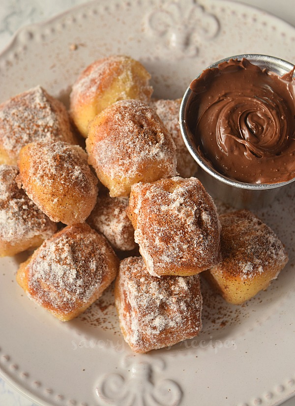 cinnamon sugar soft pretzel bites served on white plate 