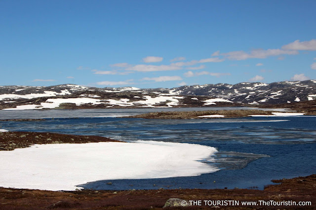 On the Scenic Route, as there is still snow on the Hardangervidda Mountain Plateau in Norway