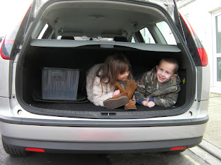 children in the boot of the car