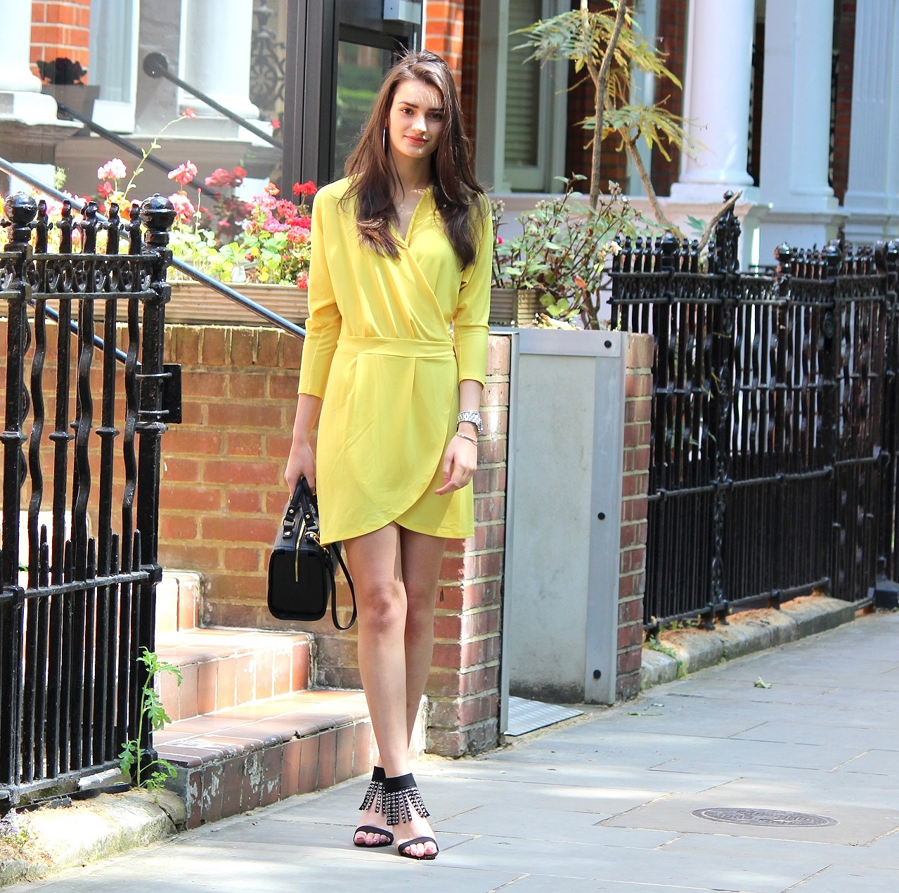 peexo-fashion-blogger-wearing-yellow-wrap-around-dress-and-black-fringe-heels-and-black-bag