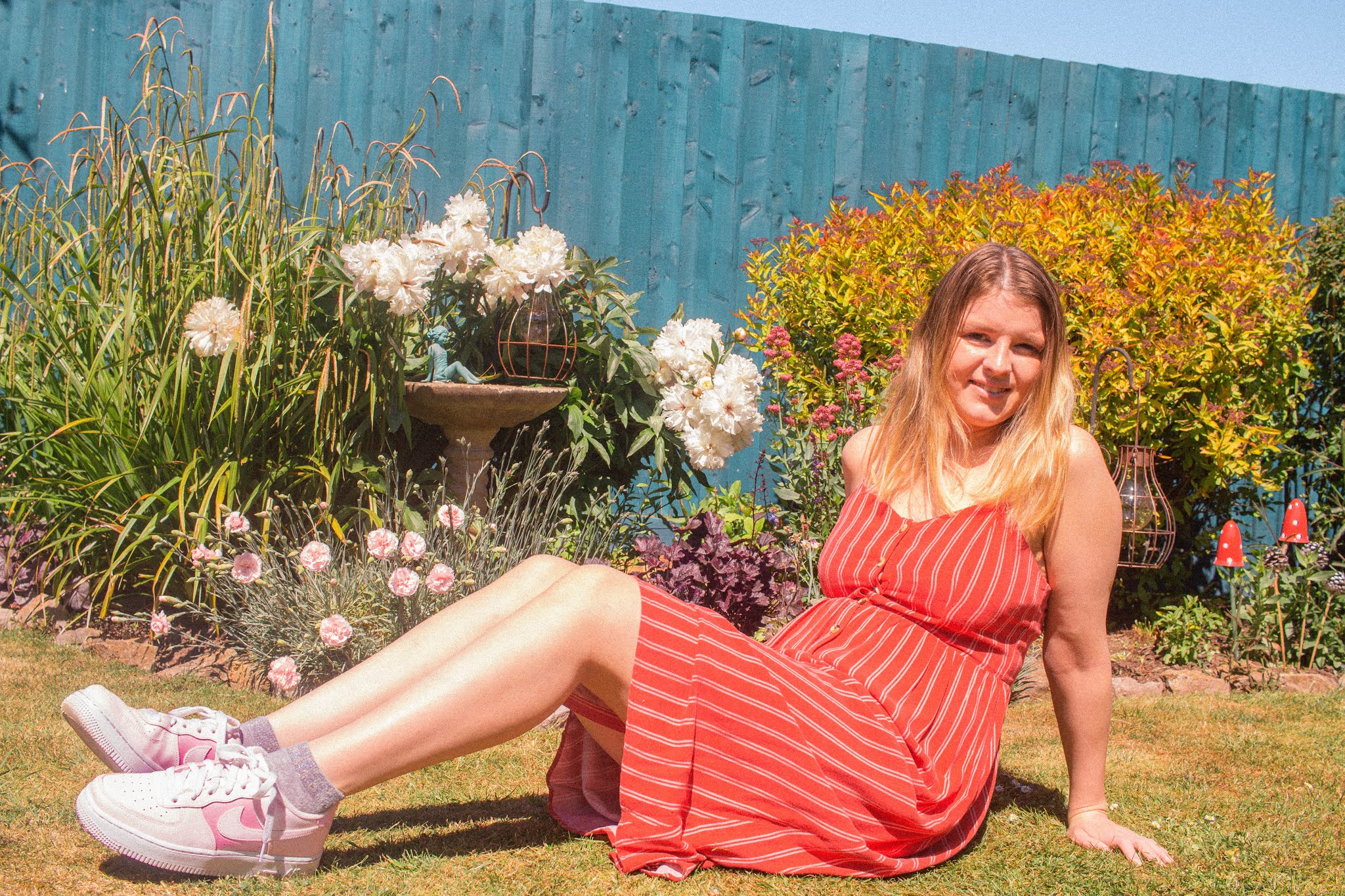 girl wearing red dress in flower garden - fashion blogger tips to enjoy instagram again