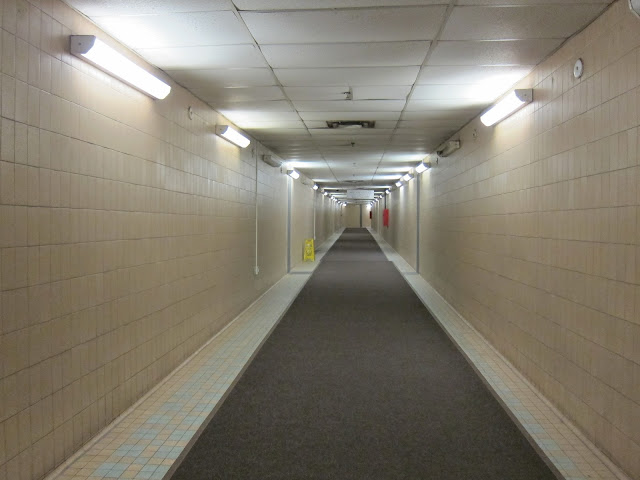 Peering down the tunnel connecting Queen's Park station to the Frost Building