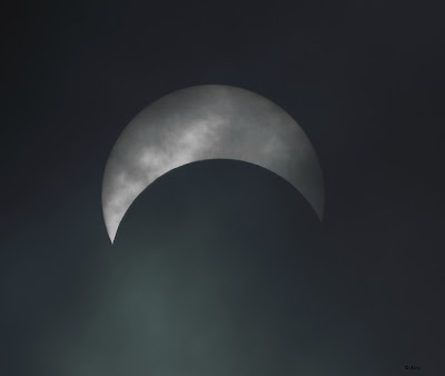 "Solar eclipse as aeen in the overcast sky Mount Abu."