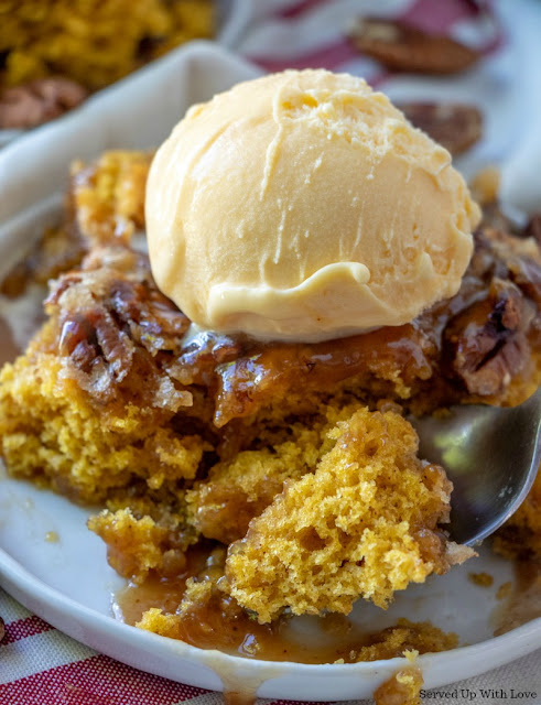 Pumpkin crunch cobbler recipe on a plate with a dollop of vanilla ice cream on top