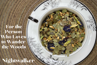 A photo of tea leaves in a cup with text reading "for the person who loves to wander the woods: nightwalker"