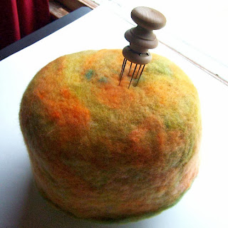 needle felted wool hat on foam base