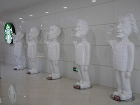 statues of world leaders at a mall in Dalian, China