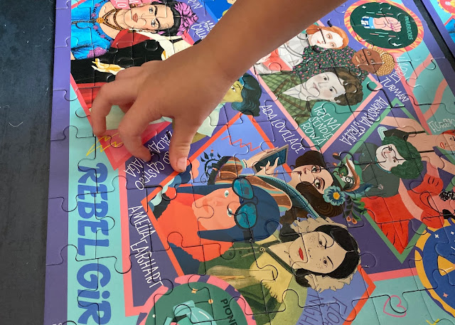 the final piece A close up of a child's hand putting the final piece in the jigsaw puzzle