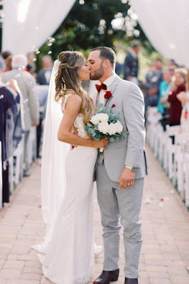 bride and groom kiss after ceremony