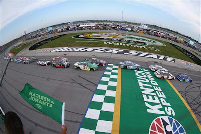 Martin Truex Jr., driver of the #78 Auto-Owners Insurance Toyota, leads the field past the green flag to start the Monster Energy NASCAR Cup Series Quaker State 400 presented by Walmart at Kentucky Speedway on July 14, 2018 in Sparta, Kentucky. 