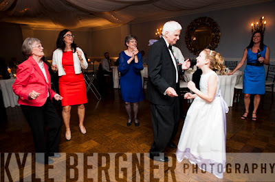 Father of the Groom and Flower Girl dancing at the wedding reception