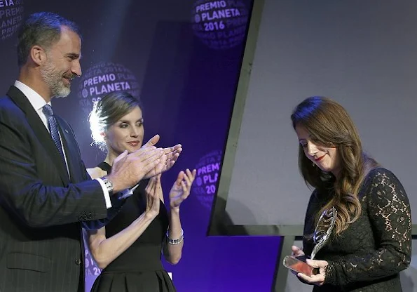 Queen Letizia wore Signe Bøgelund Jensen Two Fold Skirt, Tod's. Black Satin Clutch, Magrit Sandals