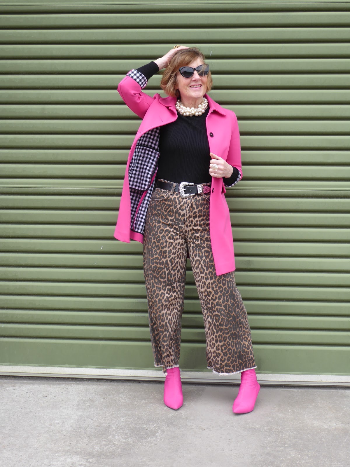 Bright pink jacket and leopard trousers