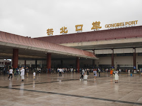 People waiting for Gongbei Port to open after Typhoon Hato hit Zhuhai