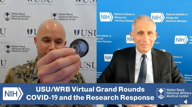 Army Lt. Col. (Dr.) Jason Blaylock, chief of Medicine at Walter Reed-Bethesda, presents Dr. Anthony Fauci with the Uniformed Services University coin virtually.