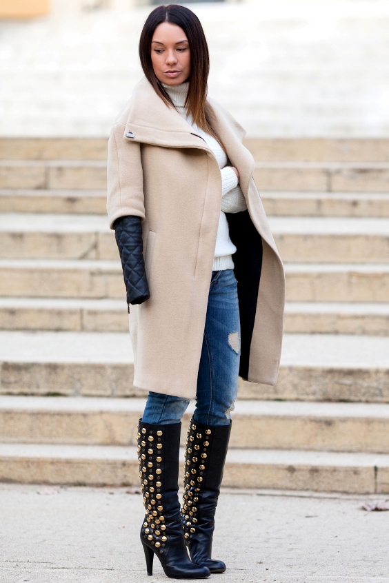Woman wearing a coat, jeans and black knee high boots
