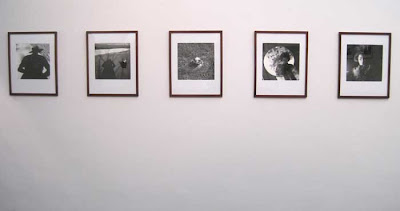 Wall of five square photos