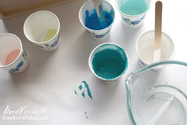 Add some water into the paper cups with paint. This is not an exact science. Mix the paint with the water until it runs off the stirring stick with a "warm honey" like consistency. If it is too runny, it won't stick to the wood project. If it is too thick, it won't move around once poured.