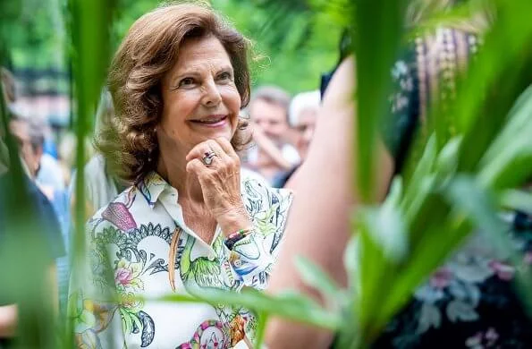 Queen Silvia wore retro floral animal print crop sleeve shirt long sleeve white cardigan blouse at Solliden Castle Park