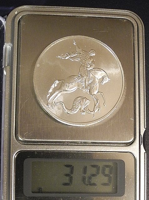 Gramm coin цена. 1 Тройская унция серебра. Монета 1с tаджикистана. 1 Унция в граммах серебро.